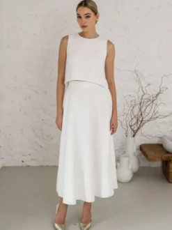 Robe de mariée deux pièces en tissu satiné boutons col bijou longueur thé dos nu sans manches ivoire