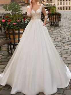 Robe de mariée ivoire col V demi manche en dentelle jupe en satin boutonné sur dos Robe de mariage
