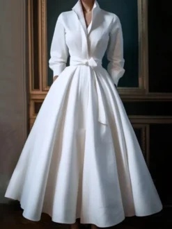 Robe de mariée vintage décolleté manches 3/4 taille naturelle tissu satiné longueur thé ceinture