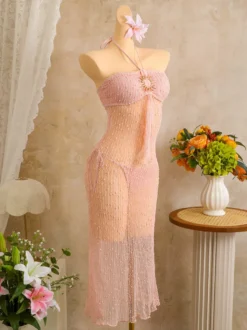 Robe de plage midi dos nu à boutons soleil en maille ajourée transparente