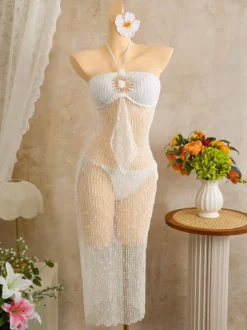 Robe de plage midi dos nu à boutons soleil en maille ajourée transparente