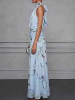 Robe de soirée longue en mousseline de soie à imprimé floral dos nu et taille froncée style licou pour une invitée de mariage