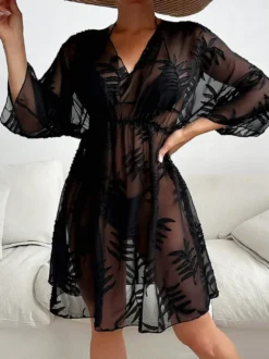 Robe de vacances chic noire à manches 3/4 et col en V transparente et sculptante
