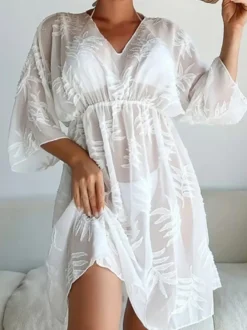 Robe de vacances chic noire à manches 3/4 et col en V transparente et sculptante