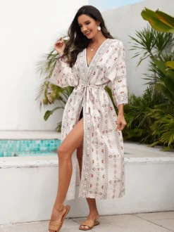 Robe de vacances imprimée bleu ciel clair à manches longues et ceinture à volants