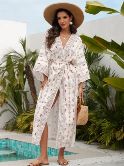 Robe de vacances imprimée bleu ciel clair à manches longues et ceinture à volants