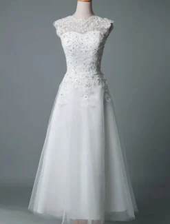 Robe mariée courte col rond en dentelle pailletes jupe en tulle zip sur dos Robe de mariage