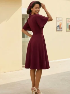 Robe rétro swing pour femme col en V froncée sur le devant boutons décoratifs manches papillon collection 2026