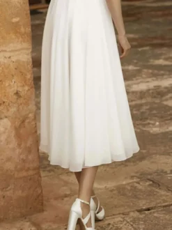 Robes de mariée courtes col bijou manches courtes longueur thé