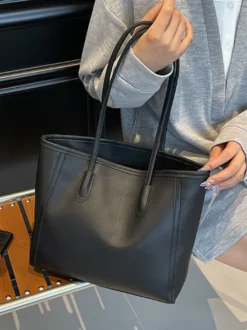 Sac cabas minimaliste en cuir à blocs de couleur grande capacité idéal pour les trajets quotidiens. Sac à bandoulière.