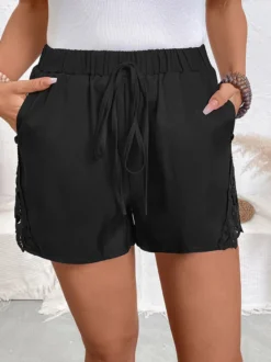 Short de plage décontracté pour femme taille élastique à cordon bordure en dentelle sur les côtés.