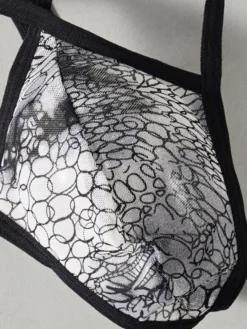 Sous-vêtement string pour homme imprimé serpent taille basse à bretelles.