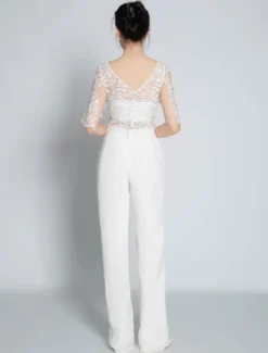 Tenue de mariée deux pièces haut en dentelle dos en V décoré des boutons pantalon en crêpe élastique
