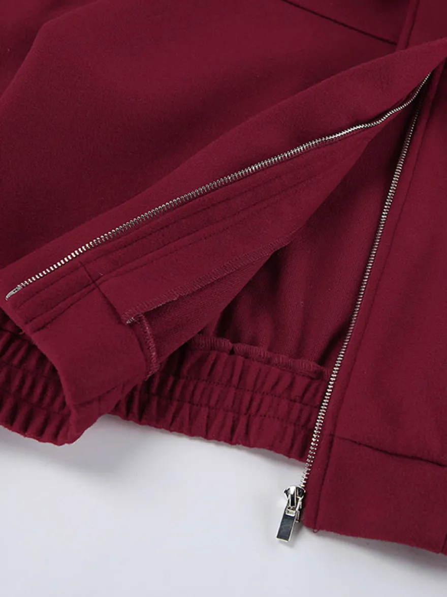 Veste bomber courte rouge bordeaux à col minimaliste fermeture éclair intégrale et poignets élastiques