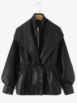 Veste oversize en similicuir à larges revers taille élastiquée bicolore noir et marron.